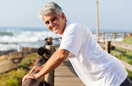 Live Well - Man Pausing on Beach